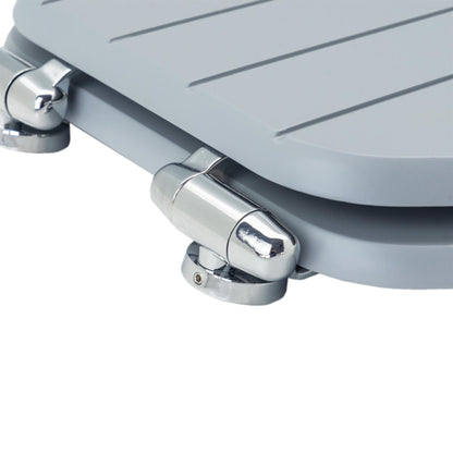 Close-up of chrome-plated soft-close hinges on a grey soft-close tongue and groove MDF wood toilet seat
