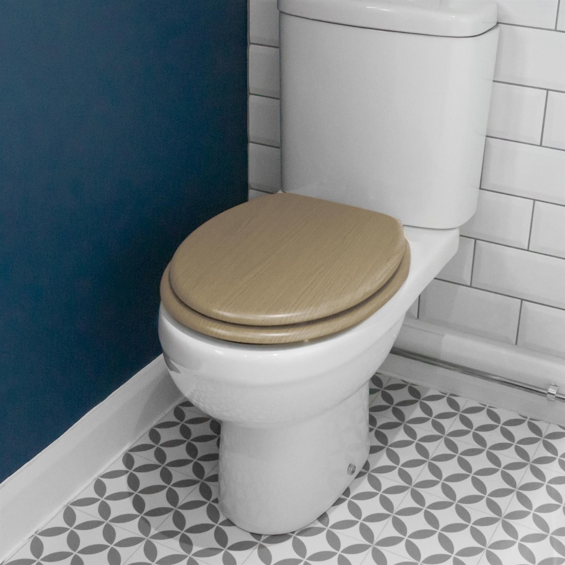 Light Oak soft-close tongue and groove MDF wood toilet seat showing seat in place on a white ceramic toilet