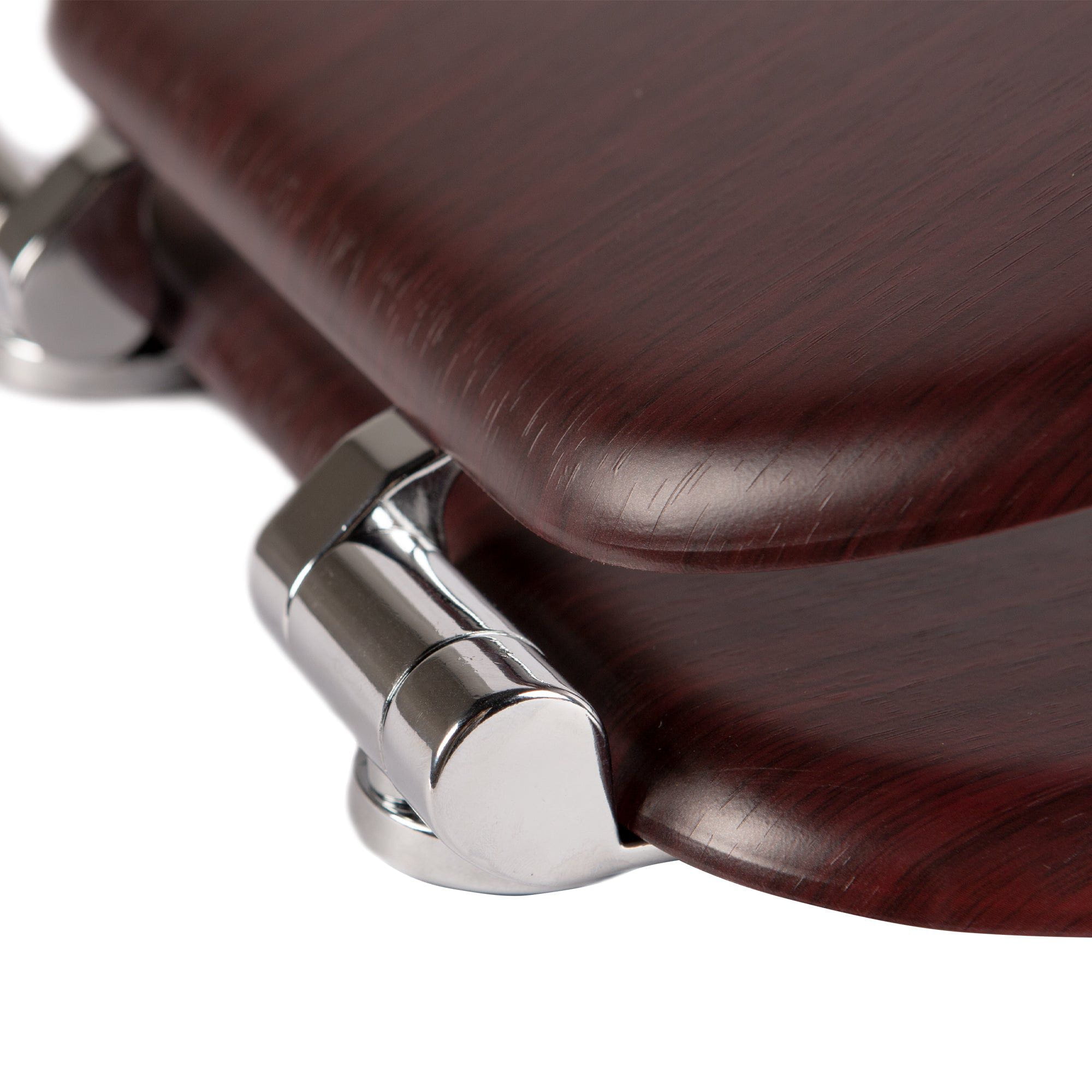 Close-up of chrome-plated soft-close hinges on a mahognay soft-close tongue and groove MDF wood toilet seat