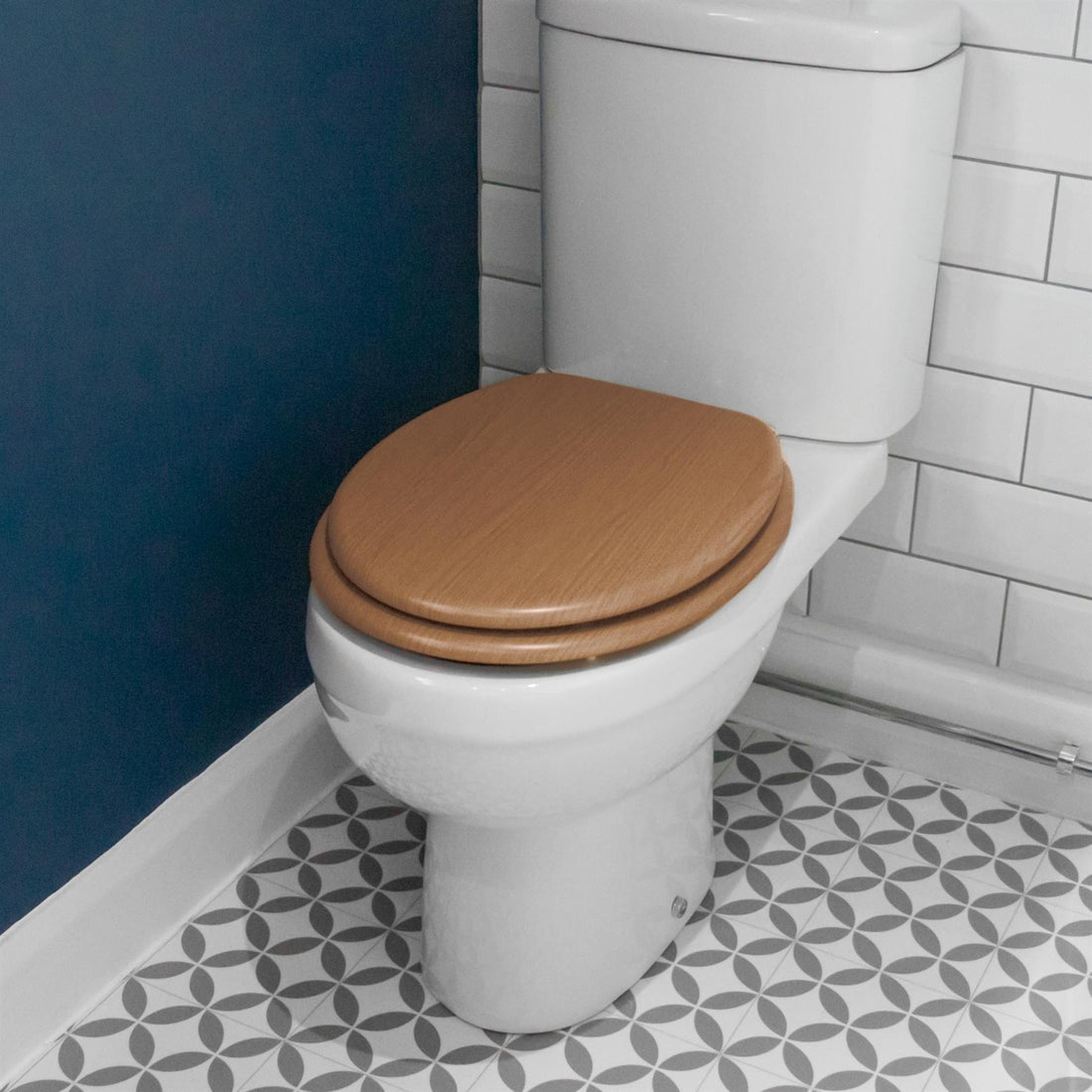 Dark Oak soft-close tongue and groove MDF wood toilet seat showing seat in place on a white ceramic toilet